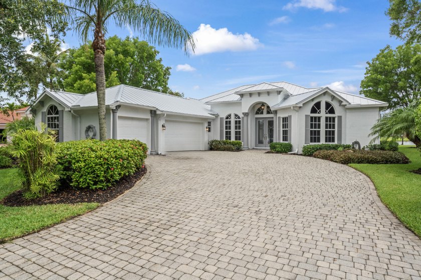 Stunning lakefront home in Florida Club with sweeping views, SW - Beach Home for sale in Stuart, Florida on Beachhouse.com