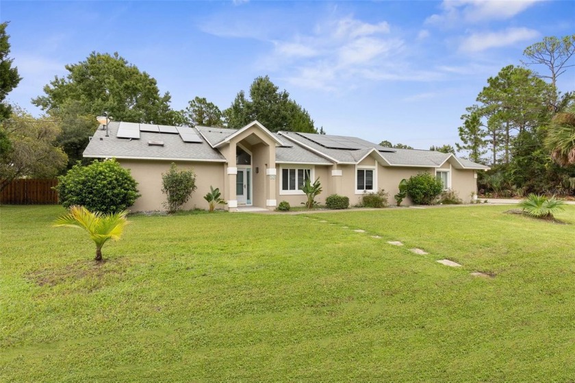 Nestled on a large fenced corner lot is this beautiful custom - Beach Home for sale in Palm Coast, Florida on Beachhouse.com