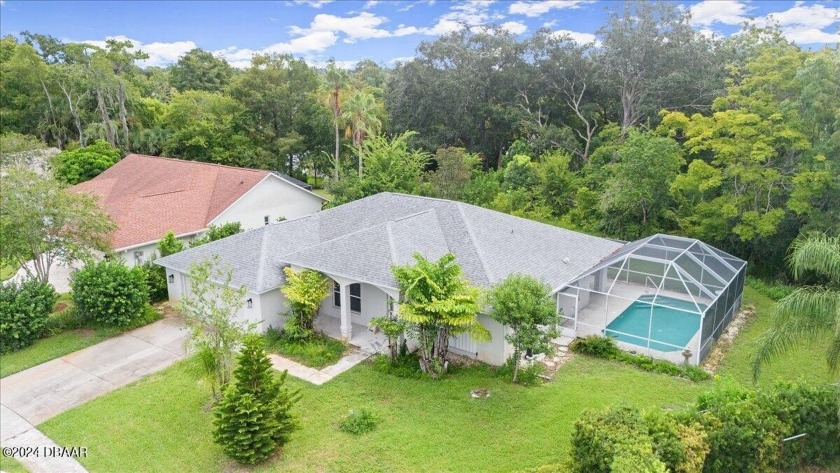 Discover this inviting 3 bedroom, 2 bath pool home in the heart - Beach Home for sale in Port Orange, Florida on Beachhouse.com