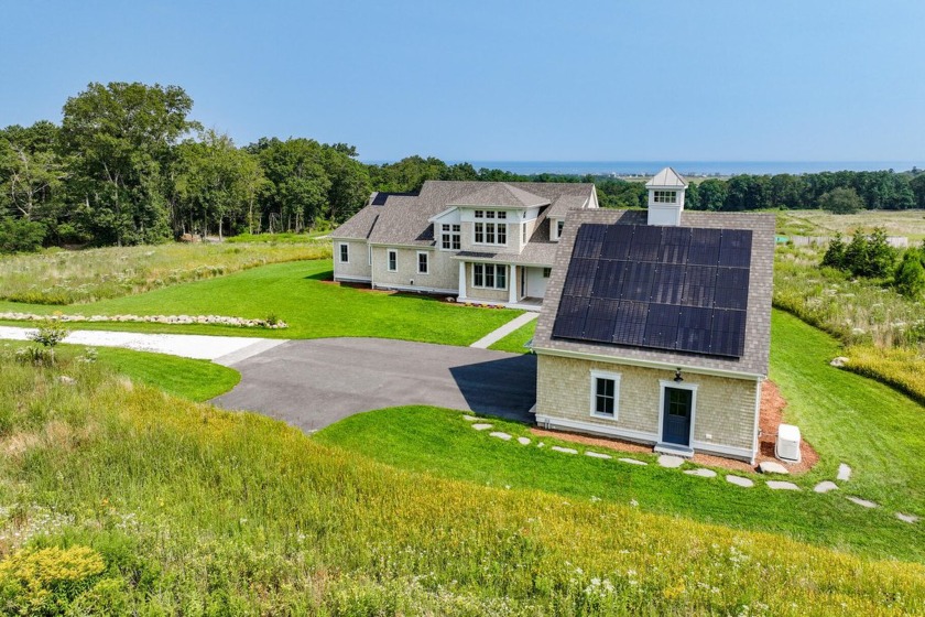 Step inside this Modern Farmhouse and the expansive Cape Cod Bay - Beach Home for sale in East Sandwich, Massachusetts on Beachhouse.com