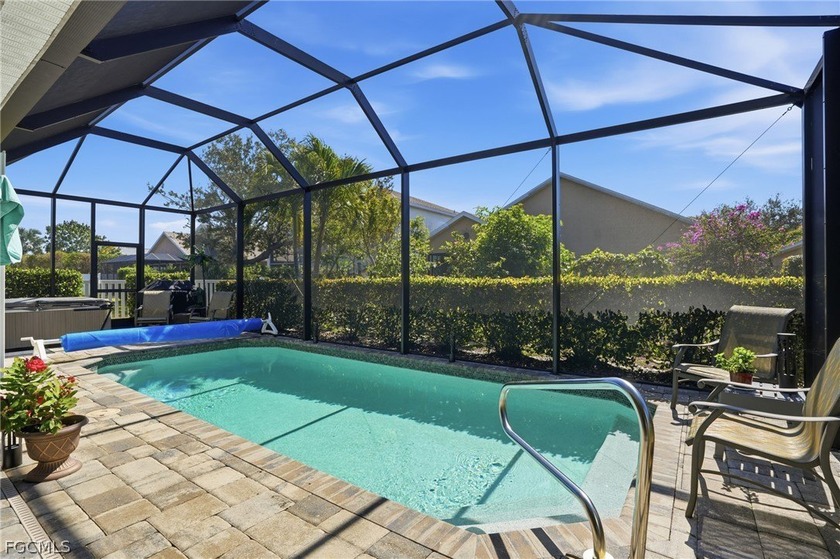 Located on a QUIET PRIVATE LOOP within a GATED community, this - Beach Home for sale in Fort Myers, Florida on Beachhouse.com