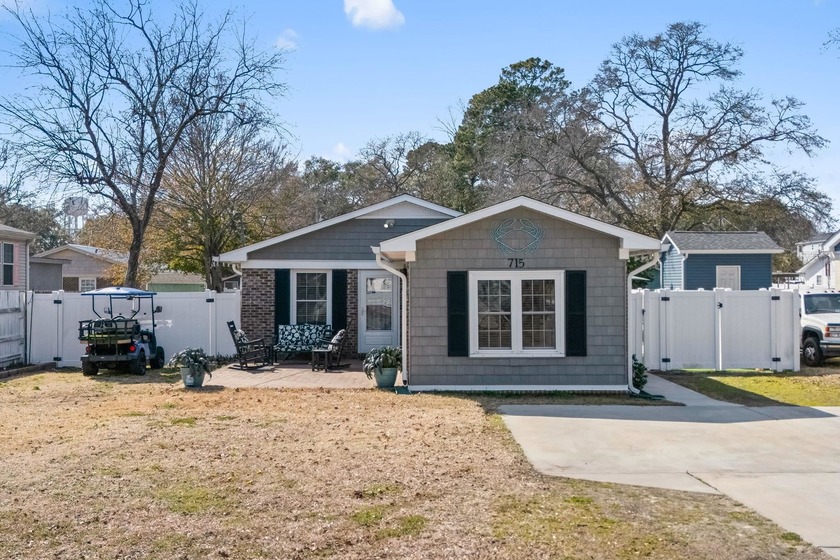 Coastal breezes, golf cart rides, and laid-back beach living - Beach Home for sale in Surfside Beach, South Carolina on Beachhouse.com