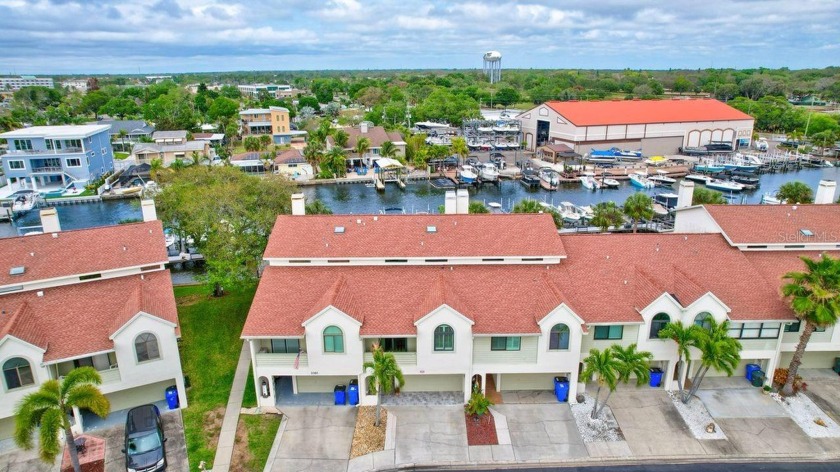 This one is a MUST SEE! Immerse yourself in the epitome of - Beach Townhome/Townhouse for sale in Dunedin, Florida on Beachhouse.com