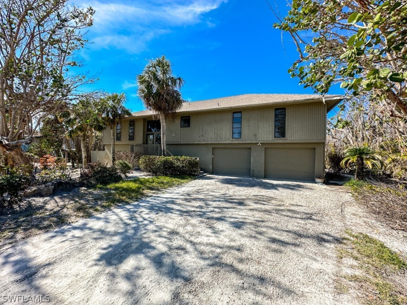 Located near a private deeded beach access, this 3BR/3BA home - Beach Home for sale in Sanibel, Florida on Beachhouse.com