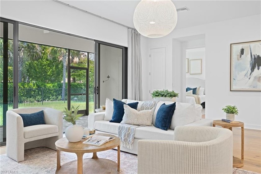 PRICED TO SELL! STUNNING custom Acadia floor plan featuring - Beach Home for sale in Estero, Florida on Beachhouse.com