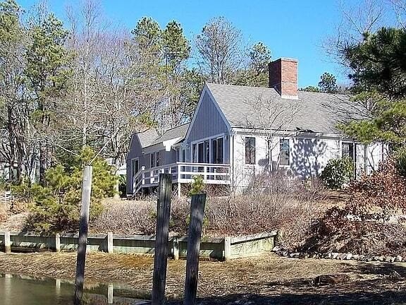 Discover the potential of this waterfront mid-century ranch on - Beach Home for sale in Mashpee, Massachusetts on Beachhouse.com