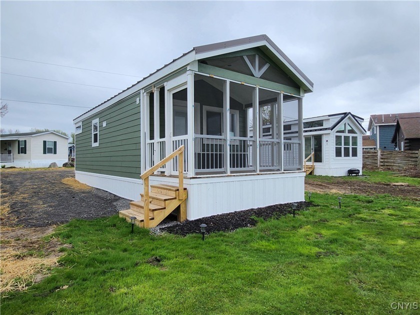 Experience this new, turnkey mobile lakeside retreat, located on - Beach Home for sale in Henderson, New York on Beachhouse.com