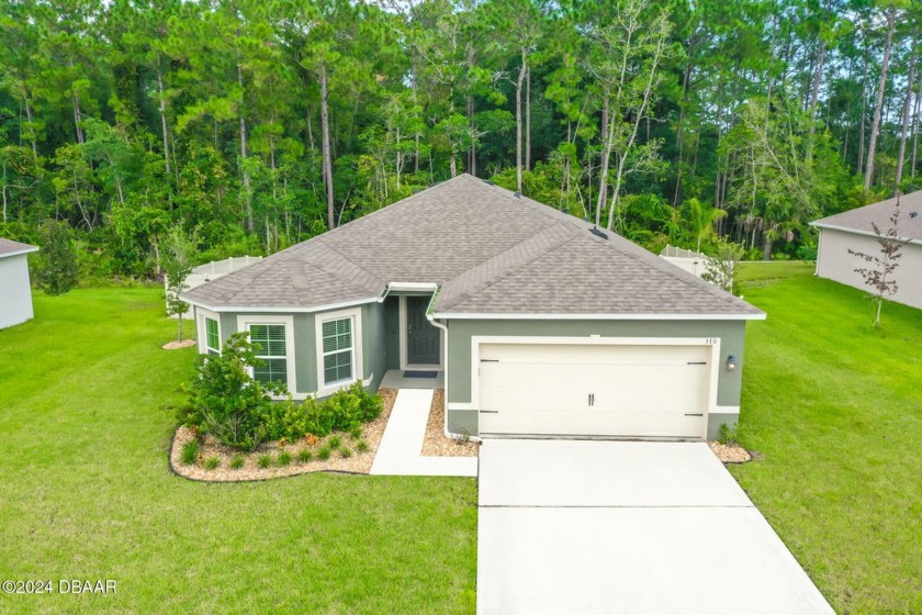 NESTLED IN THE HEART OF ORMOND BEACH THIS EASTHAM MODEL HOME - Beach Home for sale in Ormond Beach, Florida on Beachhouse.com