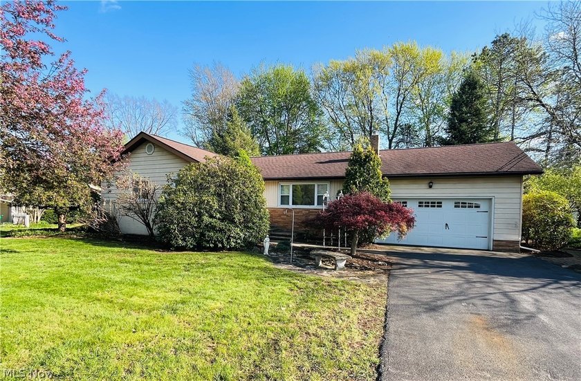 Welcome home to this versatile, raised ranch over a full - Beach Home for sale in Madison, Ohio on Beachhouse.com