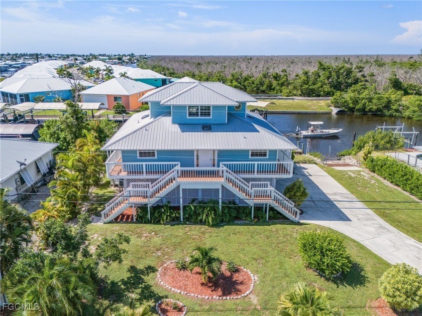 This exquisite 3-bedroom, 2-bath Key West style home offers - Beach Home for sale in St. James City, Florida on Beachhouse.com