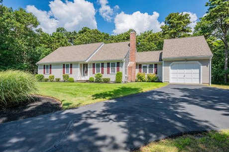 Nestled on a serene cul-de-sac, this spacious ranch at 8 - Beach Home for sale in Harwich Port, Massachusetts on Beachhouse.com