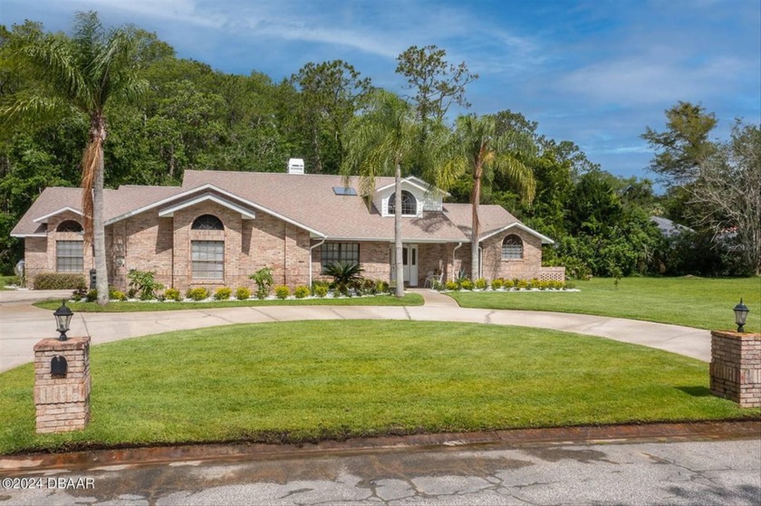 This stunning, completely renovated (2024) brick home nestled on - Beach Home for sale in Ormond Beach, Florida on Beachhouse.com