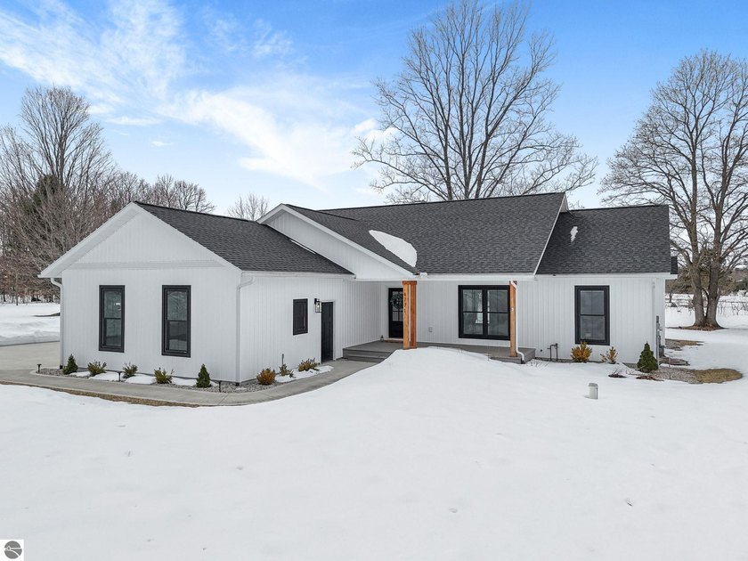 Step into modern luxury with this stunning custom-built home - Beach Home for sale in Traverse City, Michigan on Beachhouse.com