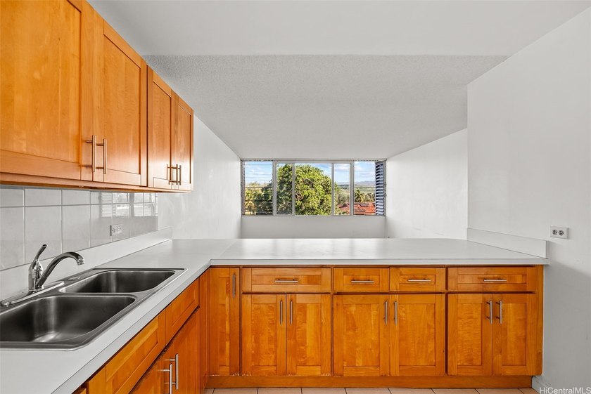 Enjoy golf course views from this centrally located 2-bedroom - Beach Condo for sale in Honolulu, Hawaii on Beachhouse.com