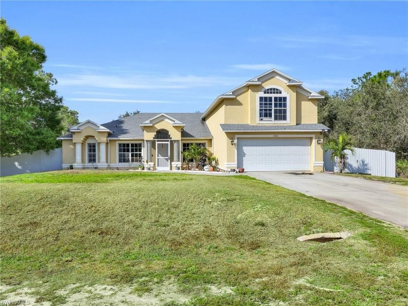This five bedroom, three bathroom two story home with a den is - Beach Home for sale in Lehigh Acres, Florida on Beachhouse.com