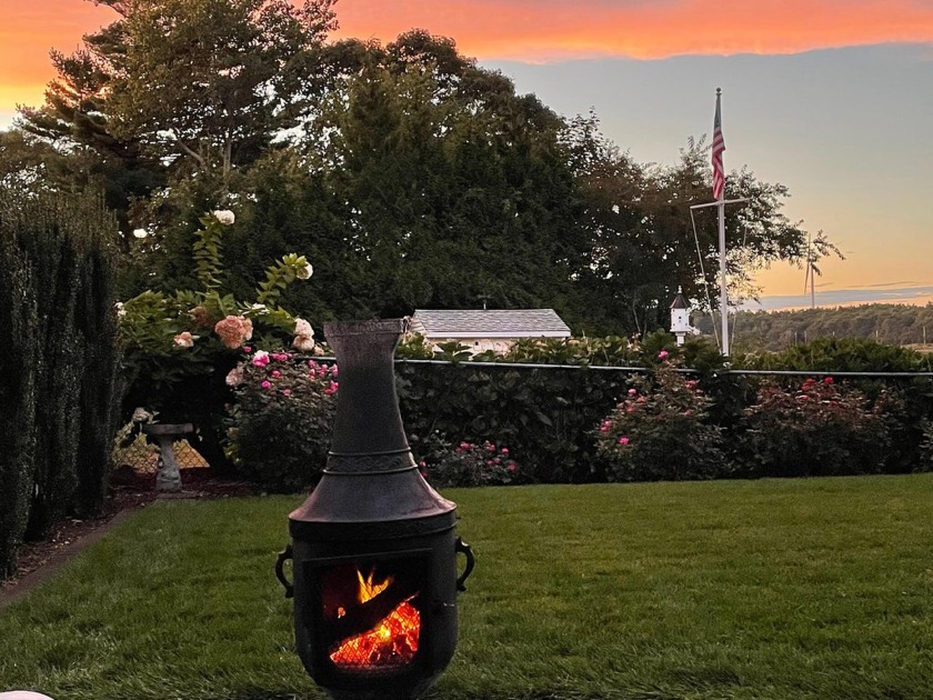 Glorious pink and purple sunsets are yours from this rare salt - Beach Home for sale in Buzzards Bay, Massachusetts on Beachhouse.com