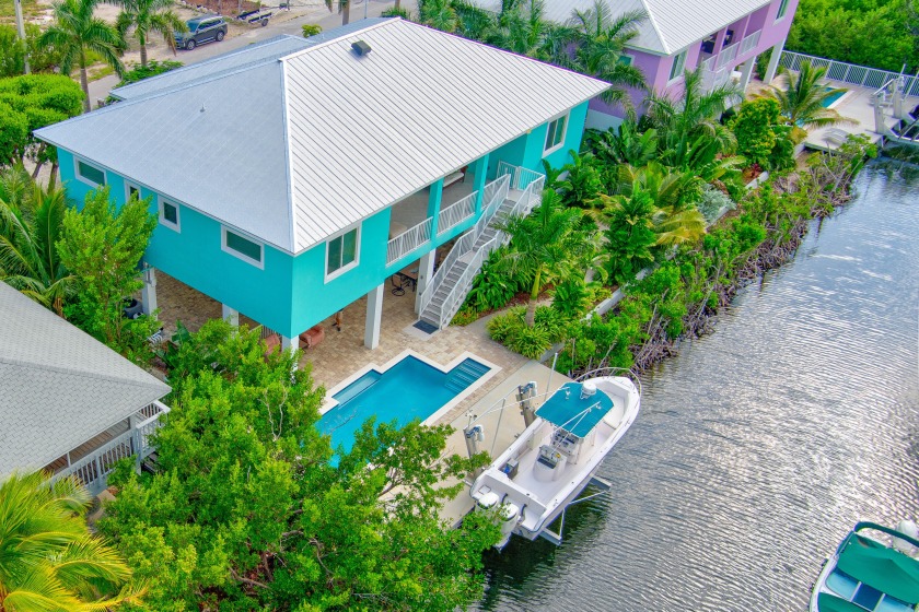 Rare Waterfront Stilted Concrete Pool Home with 4 Primary Suites - Beach Home for sale in Ramrod Key, Florida on Beachhouse.com