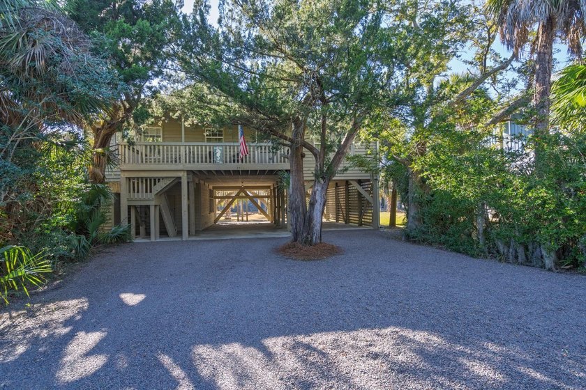 Tucked away on a secluded lot where lush coastal foliage creates - Beach Home for sale in Edisto Beach, South Carolina on Beachhouse.com