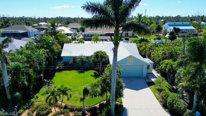 With over 3,000 sq. ft. of combined interior and exterior living - Beach Home for sale in ST. James City, Florida on Beachhouse.com