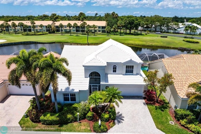 With serene views of the water and golf course, a 2021 roof, and - Beach Home for sale in Boca Raton, Florida on Beachhouse.com