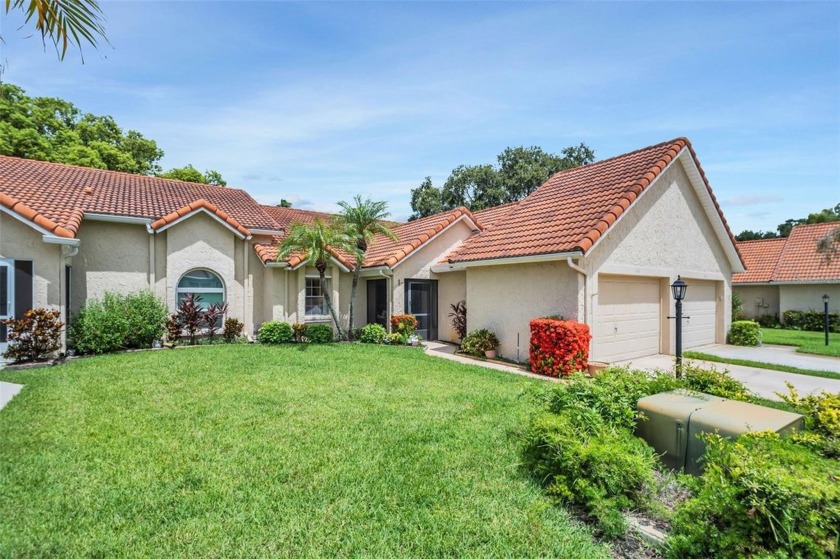Nestled in the highly sought-after Golf View Villas of Highland - Beach Home for sale in Palm Harbor, Florida on Beachhouse.com