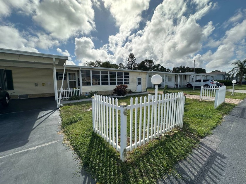 This mobile home has 3 driveways and an enclosed florida room - Beach Home for sale in Micco, Florida on Beachhouse.com