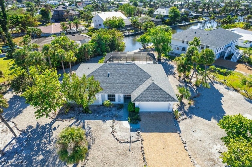 This beautifully renovated canal-front home offers the perfect - Beach Home for sale in Sanibel, Florida on Beachhouse.com