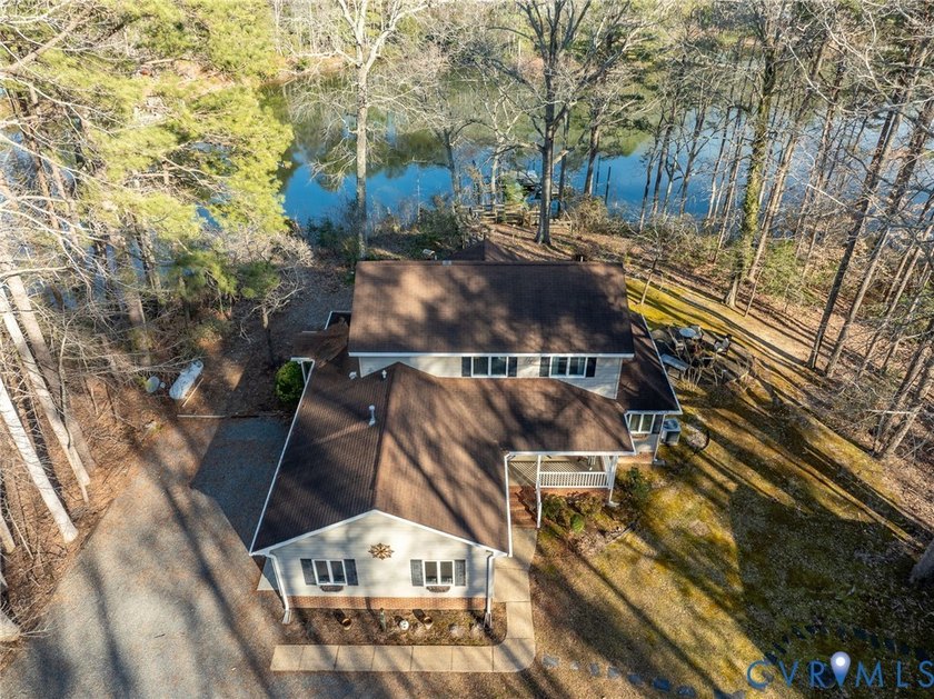 Nestled on 1.5 acres of serene waterfront, this exceptional - Beach Home for sale in Hartfield, Virginia on Beachhouse.com
