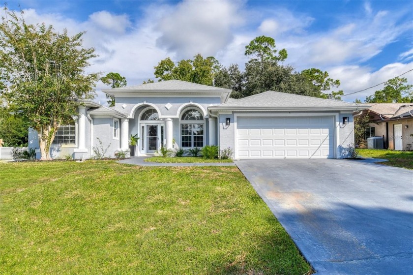 Welcome to this meticulously remodeled 4 bedroom, 2 bath, block - Beach Home for sale in Palm Coast, Florida on Beachhouse.com