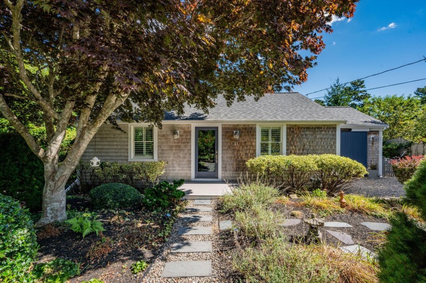 A charming retreat nestled on a beautifully landscaped lot with - Beach Home for sale in Harwich, Massachusetts on Beachhouse.com