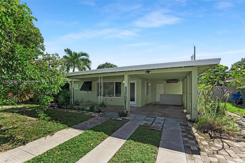 Discover this charming 2-bedroom, 2-bathroom home tucked away in - Beach Home for sale in Pompano Beach, Florida on Beachhouse.com