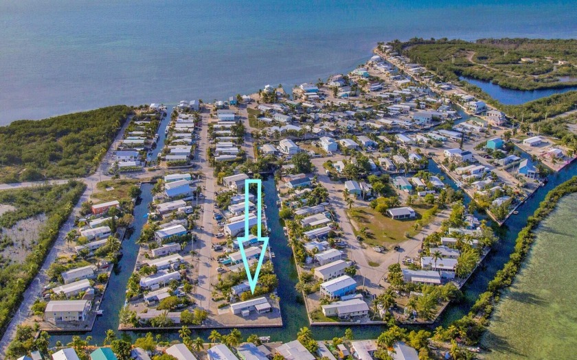 Oversized 8,113 sq. ft. corner canal front lot with over 225 ft - Beach Home for sale in Geiger Key, Florida on Beachhouse.com