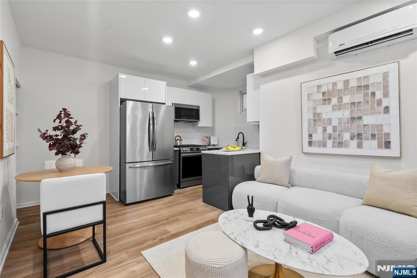 Beautifully renovated 3-bedroom, 2-bath corner townhome located - Beach Home for sale in Weehawken, New Jersey on Beachhouse.com
