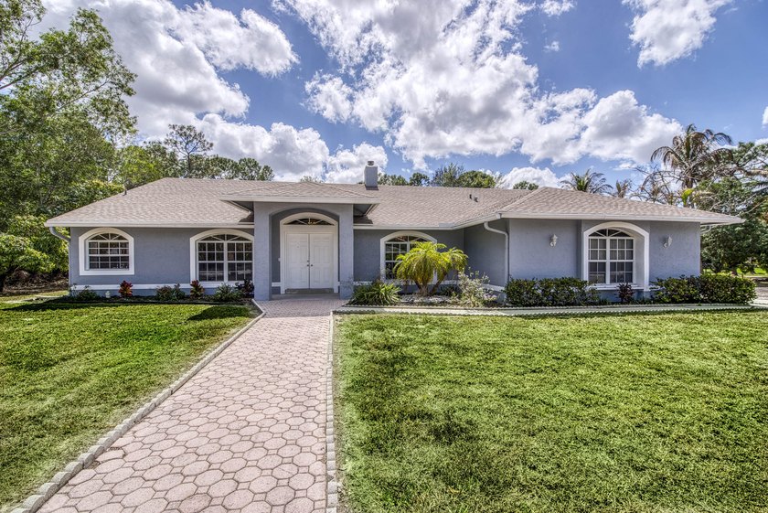 Spacious 5BR/3BA home situated on an acre in The Acreage with no - Beach Home for sale in West Palm Beach, Florida on Beachhouse.com
