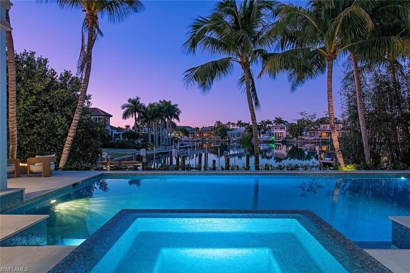 Positioned on a rare, gated corner double lot, and offering - Beach Home for sale in Naples, Florida on Beachhouse.com
