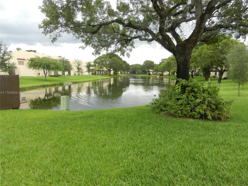 STUNNING WATERFRONT VILLA OF 3 BEDROOMS AND 2 BATHROOMS. TILE - Beach Home for sale in Pembroke Pines, Florida on Beachhouse.com