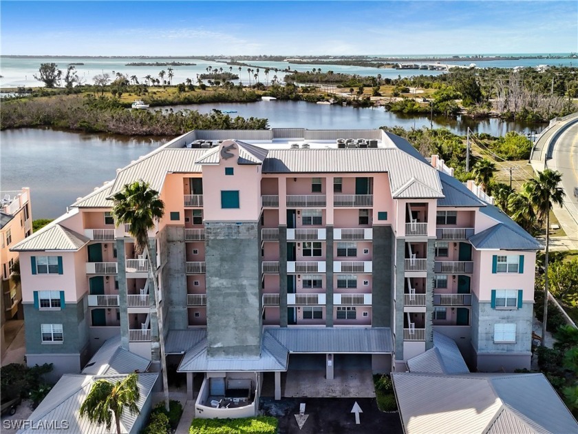 Discover luxury waterfront living in Boca Vista Harbor with this - Beach Condo for sale in Placida, Florida on Beachhouse.com