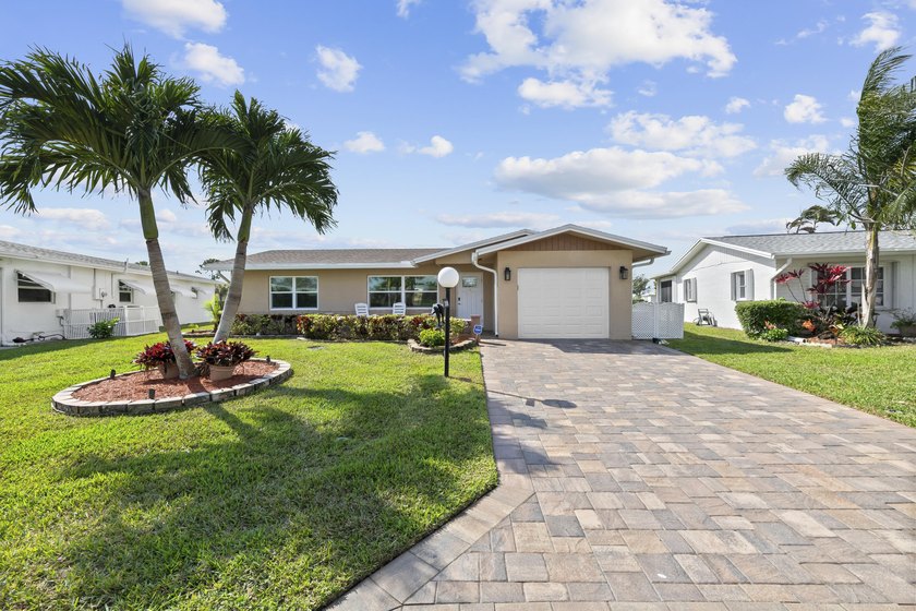 Welcome to this beautifully updated home in the desirable gated - Beach Home for sale in West Palm Beach, Florida on Beachhouse.com