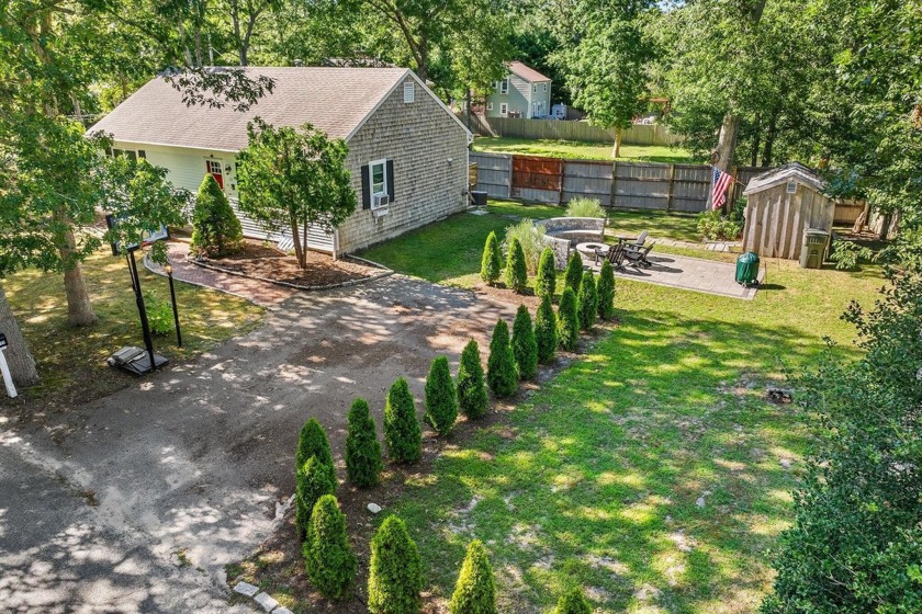 Nestled on a serene corner lot, this West Yarmouth gem invites - Beach Home for sale in West Yarmouth, Massachusetts on Beachhouse.com