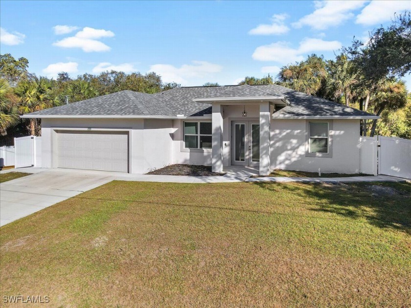 This beautiful 3-bedroom, 2-bathroom home with a 2-car garage - Beach Home for sale in Lehigh Acres, Florida on Beachhouse.com