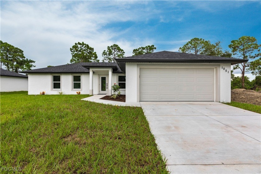 Step into this magnificent new construction home which features - Beach Home for sale in Lehigh Acres, Florida on Beachhouse.com
