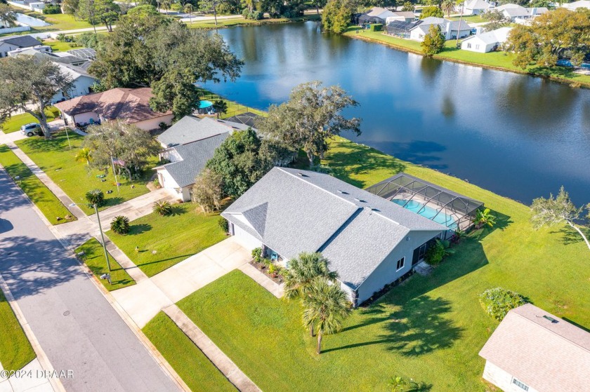 Welcome home to this beautifully remodeled lakefront pool home - Beach Home for sale in Port Orange, Florida on Beachhouse.com