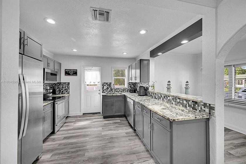 2BR/1BA home features a new kitchen, updated bath, fresh paint - Beach Home for sale in West Palm Beach, Florida on Beachhouse.com