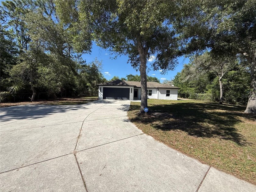 Fully renovated 3-bedroom, 2-bath home on a private 0.61-acre - Beach Home for sale in Spring Hill, Florida on Beachhouse.com