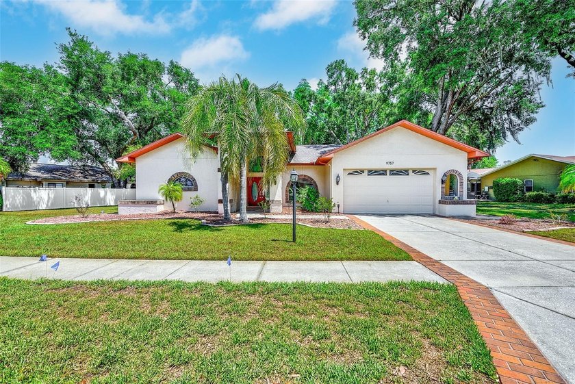 Welcome to this spacious pool home set on an oversized homesite - Beach Home for sale in New Port Richey, Florida on Beachhouse.com