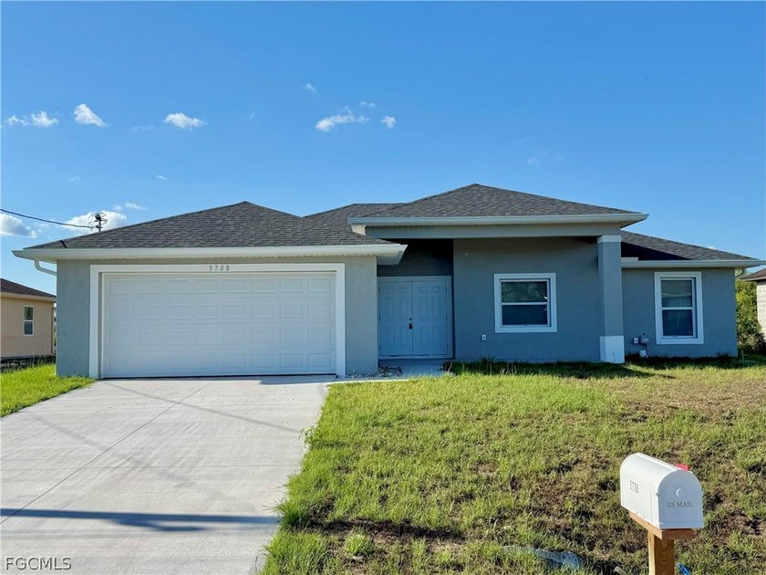 This charming 4-bedroom, 2-bathroom home offers a spacious and - Beach Home for sale in Lehigh Acres, Florida on Beachhouse.com