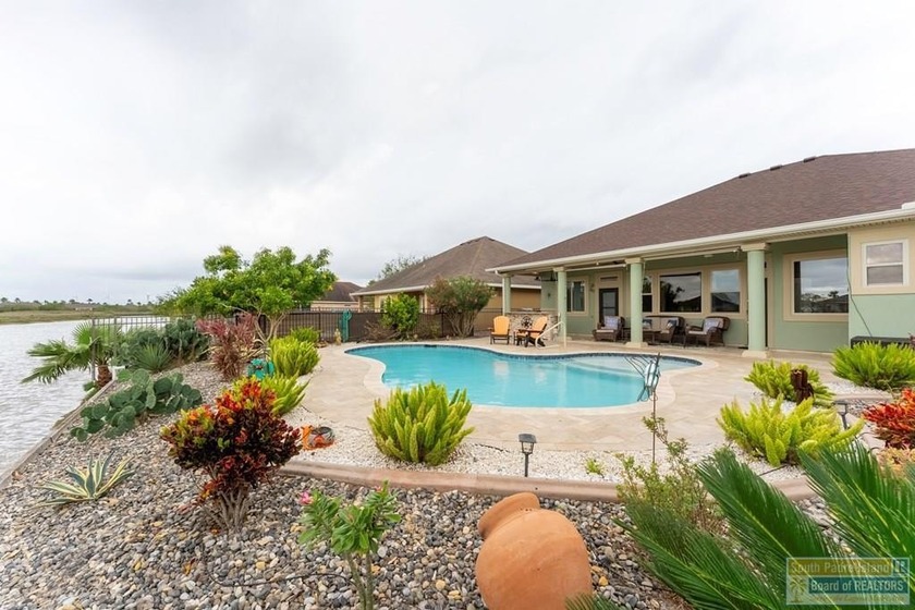 Experience refined lakefront living in this beautifully - Beach Home for sale in Laguna Vista, Texas on Beachhouse.com