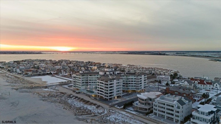 Step into a sun-drenched living room wrapped in floor-to-ceiling - Beach Condo for sale in Longport, New Jersey on Beachhouse.com