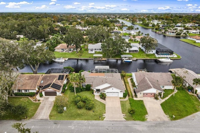 Discover this stunning waterfront pool home, ideally located - Beach Home for sale in Palm Coast, Florida on Beachhouse.com