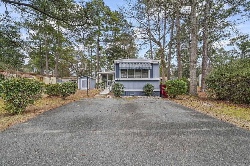 Tucked inside the charming Ocean Pines 55+ community in Murrells - Beach Home for sale in Murrells Inlet, South Carolina on Beachhouse.com